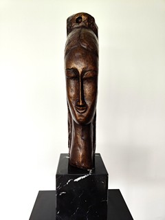 Amedeo Modigliani - Hlava mladé ženy