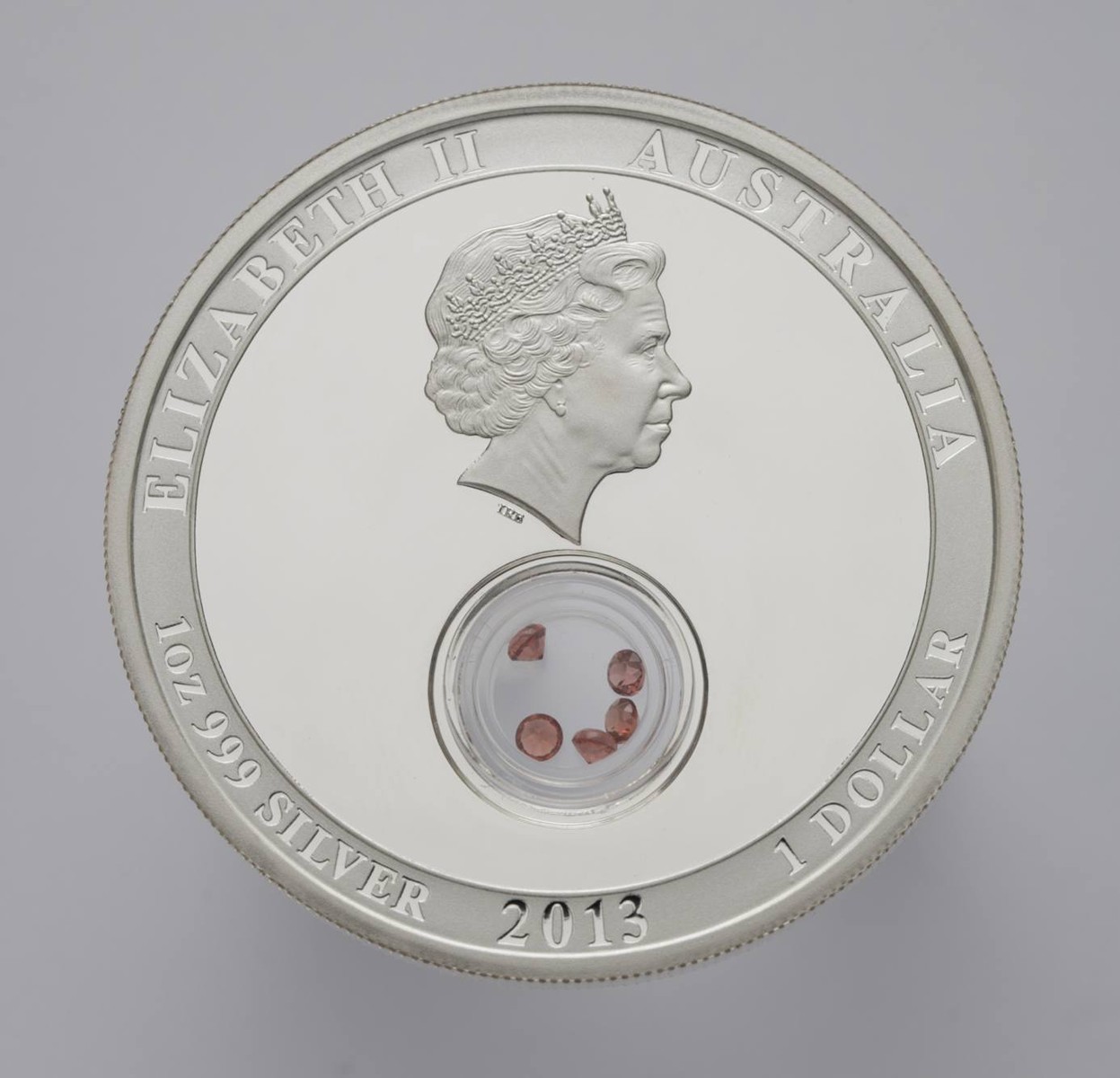 STŘÍBRNÁ MINCE 1 DOLLAR TREASURES OF THE WORLD, GARNET