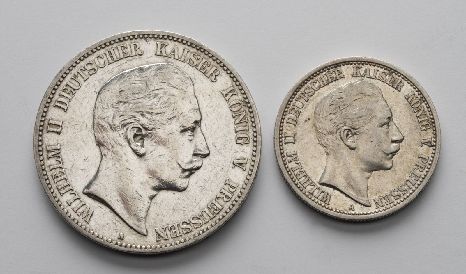 DVOJICE STŘÍBRNÝCH MINCÍ