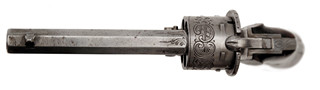 Kapesní revolver systému Loron v tajné schránce v podobě knihy