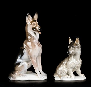 TWO SEATED DOGS
