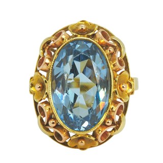 Zlatý prsten s kytičkami a modrým spinelem