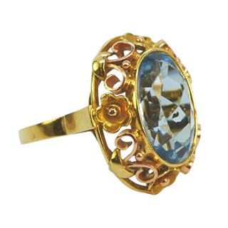 Zlatý prsten s kytičkami a modrým spinelem