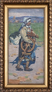 Woman in traditional costume with spinning wheel