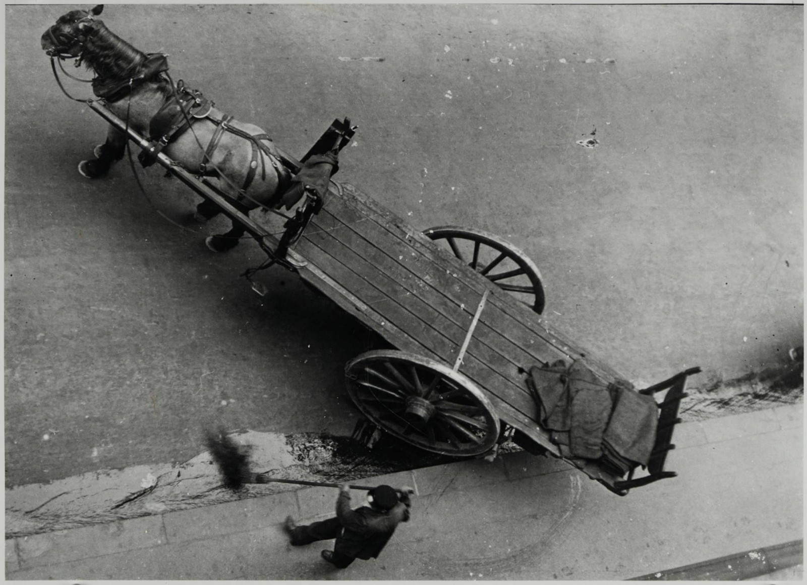 HORSE-DRAWN CART WITH A STREET SWEEPER