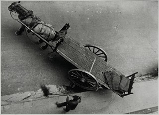 HORSE-DRAWN CART WITH A STREET SWEEPER